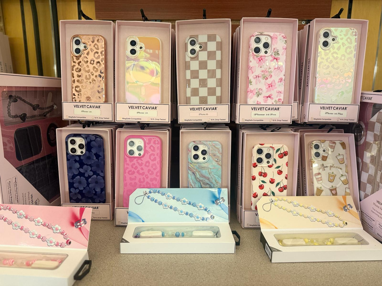 Assorted premium phone cases on bright retail wall